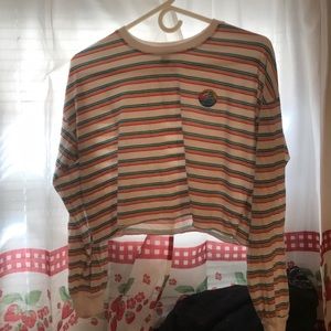 I am selling a long sleeve rainbow crop top.
